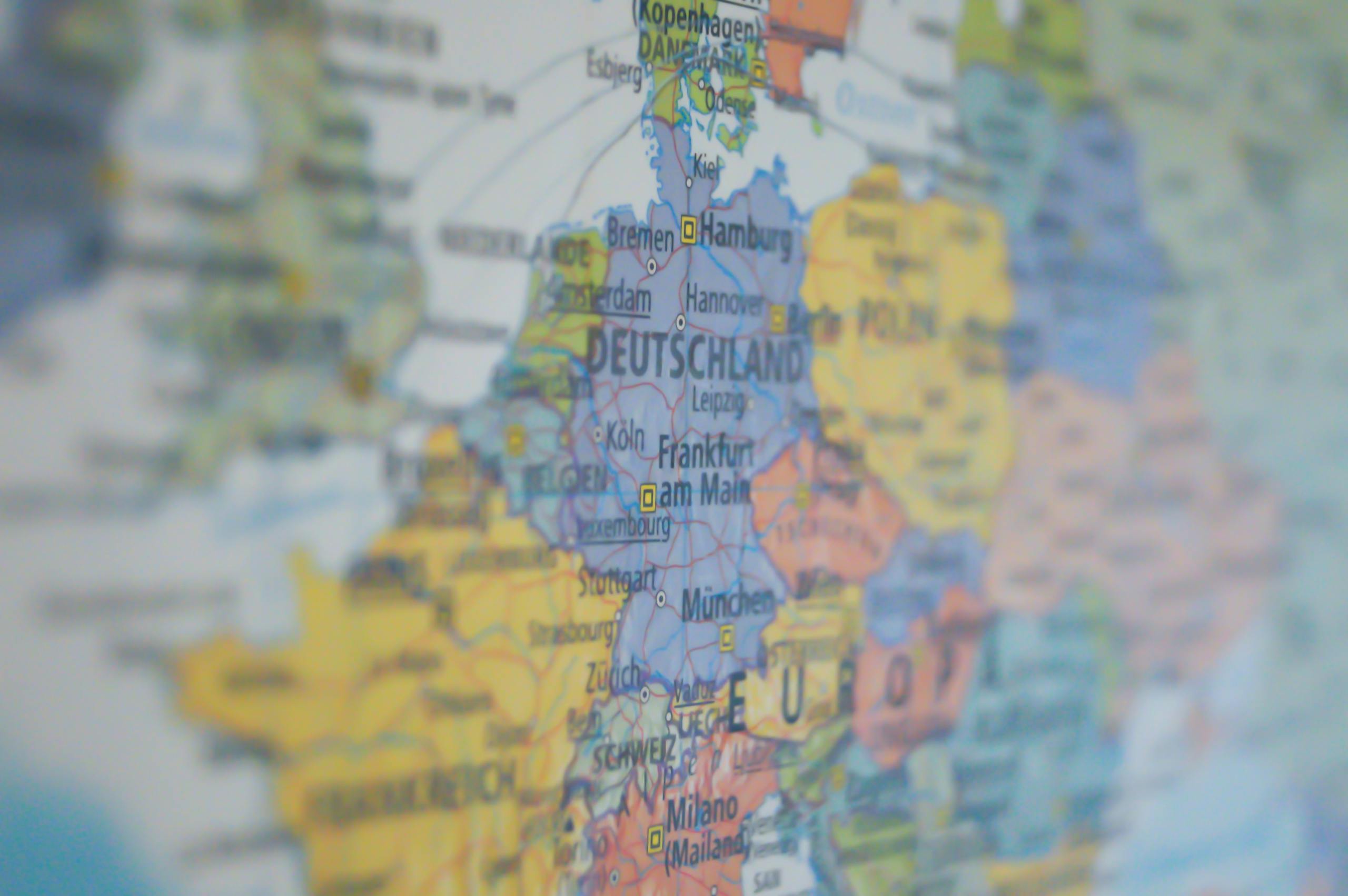 Close-up view of Europe on a colorful world map showing major cities.